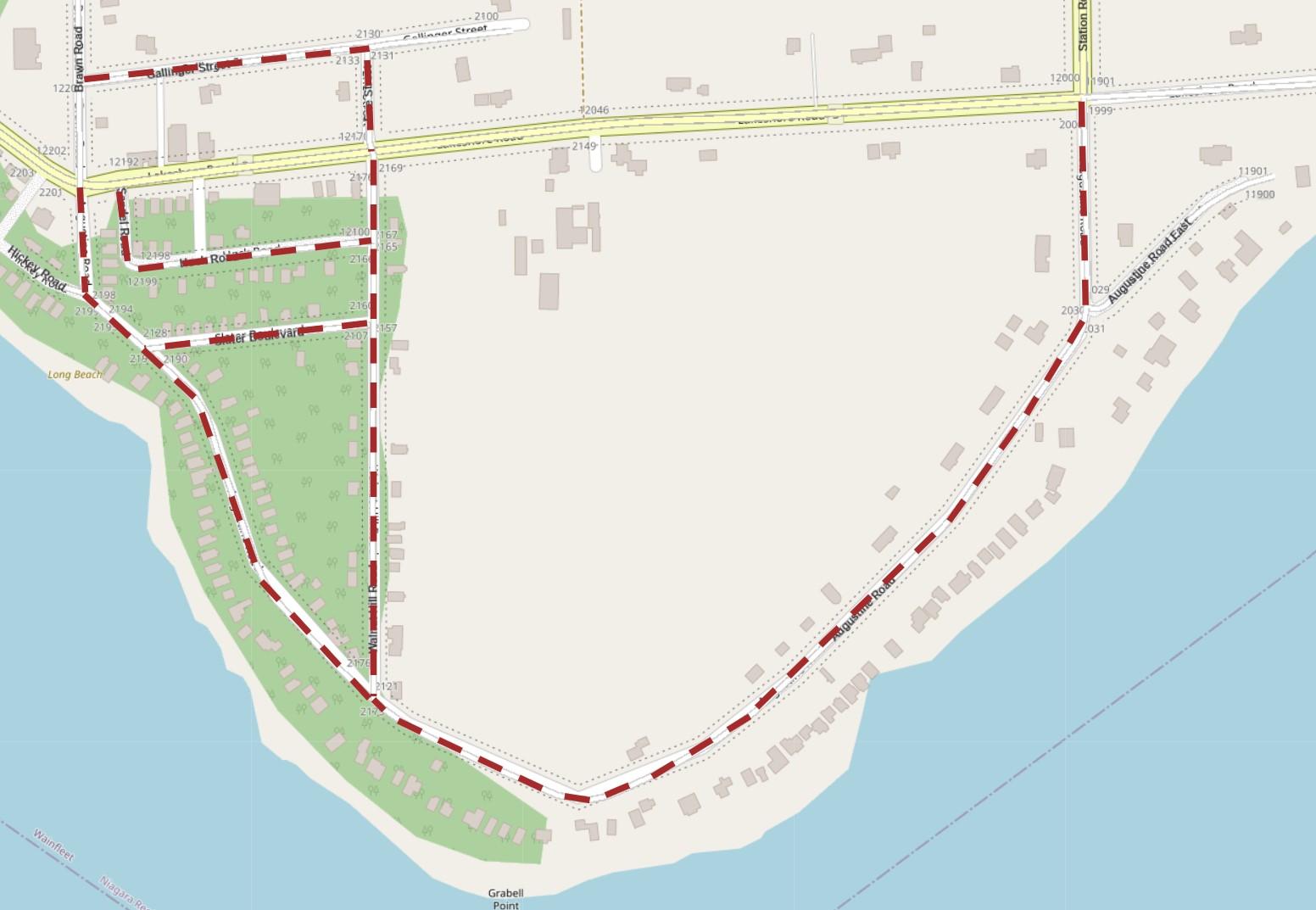 Street map showing roads and buildings along a shoreline, with green areas and water labelled as Long Beach.